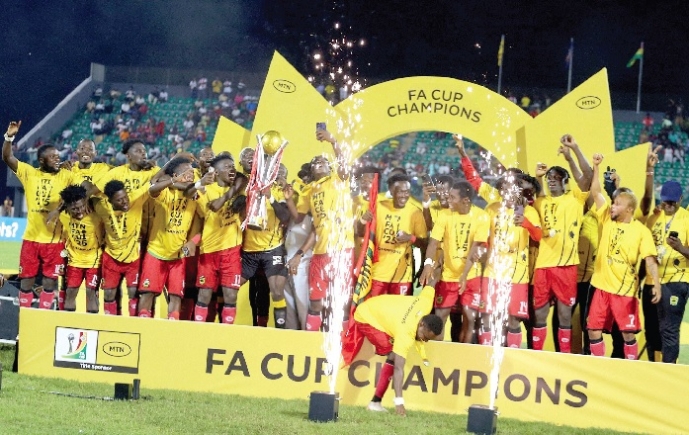 Players of Asante Kotoko celebrating their MTN FA Cup triumph with the trophy after beating Golden Kick 2-1 yesterday Players of Asante Kotoko celebrating their MTN FA Cup triumph with the trophy after beating Golden Kick 2-1 yesterday