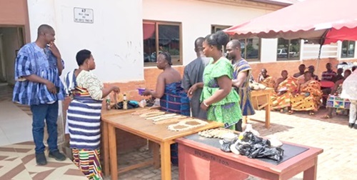 Some of the participants inspecting the indigenous seeds displayed during the exhibition Some of the participants inspecting the indigenous seeds displayed during the exhibition