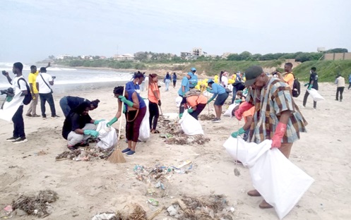 Edmond Moukala (arrowed), UNESCO Representative to Ghana, and some volunteers cleaning the beach