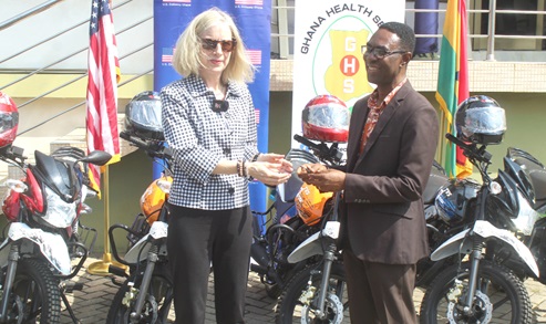 Kimberly Rosen (left), USAID/Ghana Mission Director, handing over the motorcycles to Ebo Hammond, the Director of Health Administration and Support Services of the Ghana Health Service. Picture: ESTHER ADJORKOR ADJEI 