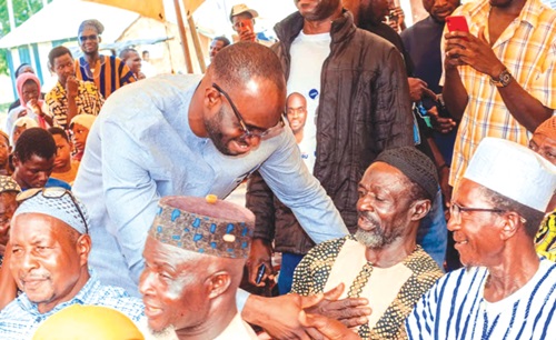 Dr Tia Abdul-Kabiru Mahama, NPP MP for Walewale, exchanging pleasantries with some constituents at the event Dr Tia Abdul-Kabiru Mahama, NPP MP for Walewale, exchanging pleasantries with some constituents at the event