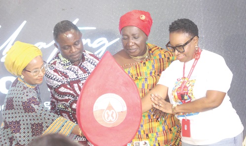 Kwabena Mintah Akandoh (2nd from left), Minister of Health, being assisted by Dr Nana Ama Amissah III (2nd from right), Queenmother, Mankessim Traditional Area; Dr Shirley Owusu-Ofori (right), CEO, National Blood Service, and a representative from WHO, to cut the cake to commemorate the World Blood Donor Day. Picture: ESTHER ADJORKOR ADJEI Kwabena Mintah Akandoh (2nd from left), Minister of Health, being assisted by Dr Nana Ama Amissah III (2nd from right), Queenmother, Mankessim Traditional Area; Dr Shirley Owusu-Ofori (right), CEO, National Blood Service, and a representative from WHO, to cut the cake to commemorate the World Blood Donor Day. Picture: ESTHER ADJORKOR ADJEI