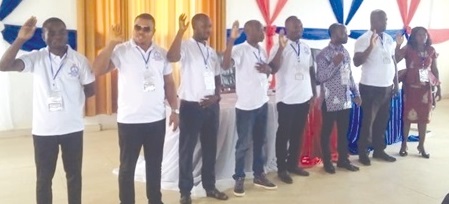 The new executive swearing an oath The new executive swearing an oath