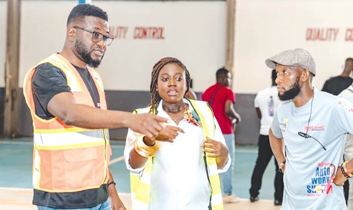 Dennis Gawuga (left), Communications Manager, CFAO, explaining a point to the participants in the workshop