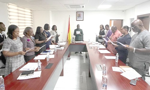 Dr Dominic Akuritinga Ayine, Attorney-General and Minister of Justice, swearing in members of the committee