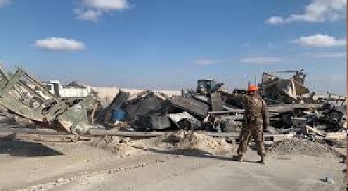 U.S. troops clear debris following an Iranian missile strike at the Ain al-Assad air base in Iraq on Jan. 8. No one was killed, and U.S. officials initially said no American service members had been injured. Ali Abdul Hassan/AP U.S. troops clear debris following an Iranian missile strike at the Ain al-Assad air base in Iraq on Jan. 8. No one was killed, and U.S. officials initially said no American service members had been injured. Ali Abdul Hassan/AP