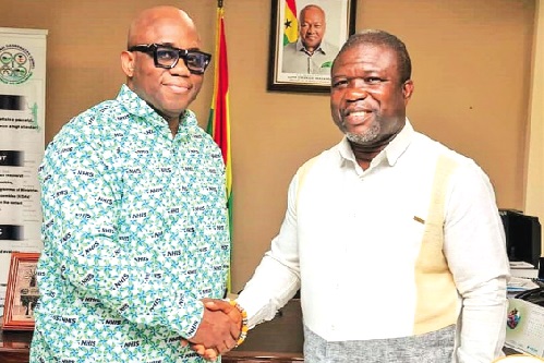 James Gunu (right), Volta Regional Minister, welcoming Dr Victor Asare Bampoe, CEO of NHIA, to his office