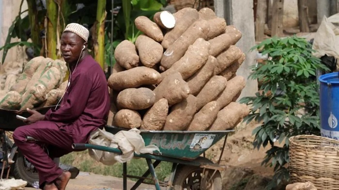 Low-income earners and small businesses like this yam seller in Lagos are set for tax exemptions