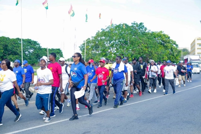 Members of the Ghana Hotels Association walking through Accra during a health walk to mark the association’s 50th anniversary.