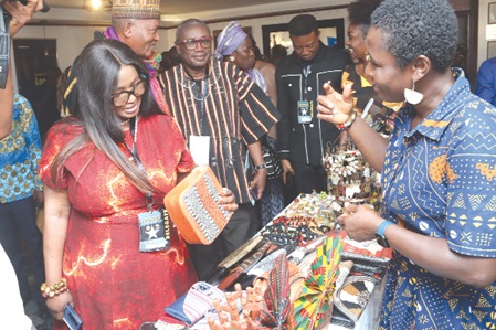 Maame Efua Houadjeto (left), CEO, Ghana Tourism Authority, and Ambassador Ikechi Uko (2nd from left), Organiser, Accra Weizo, admiring some locally made products on display at the West Africa Travel Expo. Picture: ELVIS NII NOI DOWUONA Maame Efua Houadjeto (left), CEO, Ghana Tourism Authority, and Ambassador Ikechi Uko (2nd from left), Organiser, Accra Weizo, admiring some locally made products on display at the West Africa Travel Expo. Picture: ELVIS NII NOI DOWUONA
