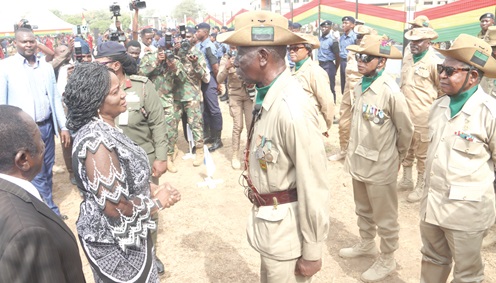 Prof. Naana Jane Opoku-Agyemang (left), Vice-President, interacting with Emmanuel Kuma (2nd from left), WO 1 retired, and some veterans after the ceremony in Osu. Picture: ELVIS  NII NOI DOWUONA 