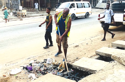 Alhaji Ibrahim Sulley, Presiding Member of the assembly, desilting a choked gutter during the clean-up exercise Alhaji Ibrahim Sulley, Presiding Member of the assembly, desilting a choked gutter during the clean-up exercise