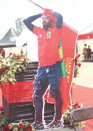 A life-size cutout of Pooley erected at the funeral ground yesterday A life-size cutout of Pooley erected at the funeral ground yesterday