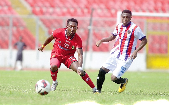 Kotoko’s Daniel Adjetey gains control of the ball ahead of Emmanuel Gyamfi of Legon Cities during their game yesterday. Picture: EMMANUEL BAAH Kotoko’s Daniel Adjetey gains control of the ball ahead of Emmanuel Gyamfi of Legon Cities during their game yesterday. Picture: EMMANUEL BAAH