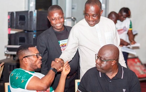 Dr Asmah (seated left) in a hearty chat with a loyal customer of Amenfiman Bank while Dr Toni Aubynn (seated right), Board Chairman, and Robert Asare, Head of Community Engagement, look on admirably