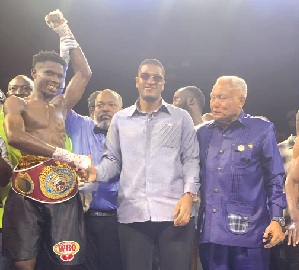 Referee Erasmus Owoo raises Faisal Abubakari’s hand in victory as Sharaf Mahama (centre), co-promoter, congratulates him with a handshake Referee Erasmus Owoo raises Faisal Abubakari’s hand in victory as Sharaf Mahama (centre), co-promoter, congratulates him with a handshake