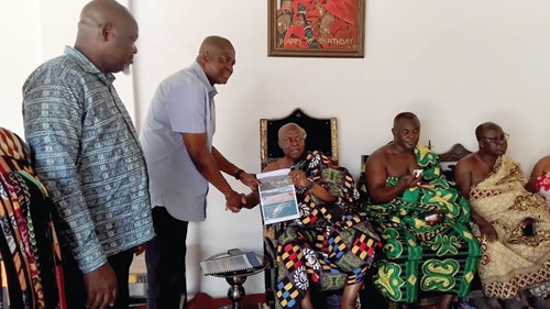 Stephen Abgo (2nd from left), Deputy Manager, Community Relations, Minerals Commission, presenting the handover document to Ogyeahoho Yaw Gyebi ll, Paramount Chief of Sefwi Anhwiaso Traditional Area Stephen Abgo (2nd from left), Deputy Manager, Community Relations, Minerals Commission, presenting the handover document to Ogyeahoho Yaw Gyebi ll, Paramount Chief of Sefwi Anhwiaso Traditional Area