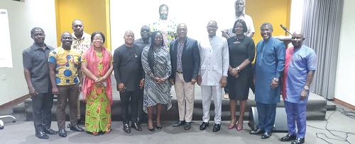 Dr Clement Apaak (4th from right), Deputy Education Minister designate, and Professor George K. T. Oduro (5th from right), Chairman of the planning committee, with other members of the committee and editors after the opening session