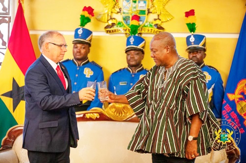 President Mahama (right) proposing a toast to Julio Enrique Pujol Torres, Cuban Ambassador to Ghana