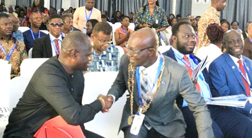 Dr Anthony Arko Adjei (right), GhIS President,  welcoming Emmanuel Armah-kofi Buah, Minister for Lands and Natural Resources, to the conference 