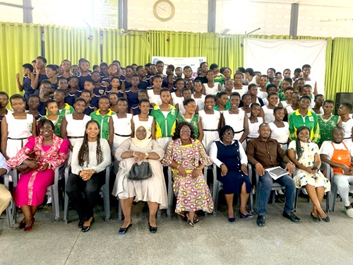 Bernice Ofori (seated 5th from right), Tema Metropolitan Director of Education, and other guests and students who participated in the event