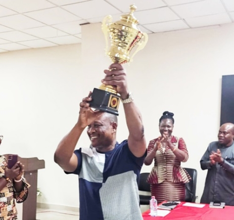 Bismark Otoo, Regional General Manager, Accra East, ECG, with the trophy Bismark Otoo, Regional General Manager, Accra East, ECG, with the trophy