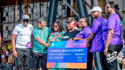 Rev. Anthony Cudjoe (2nd from left) and the ICGC delegation after presenting the dummy cheque to Dr Pinaman Appau (4th from left), the CEO of the Mental Health Authority. With them are other pastors of the church and officials of the Mental Health Authority