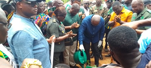 President John Dramani Mahama (with watering can) planting the commemorative tree to launch the Tree for Life Reforestation Initiative at Nkawie in the Ashanti Region. Picture: EMMANUEL BAAH