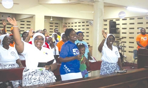 Members of the Presbyterian Church of Ghana, Shalom Congregation, singing joyfully 