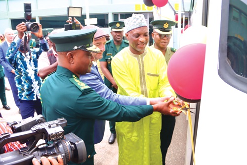 Muntaka Mohammed-Mubarak (right), Minister for the Interior, being assisted by Daniel Krull (middle), German Ambassador to Ghana, and Samuel Basintale Amadu (left), Comptroller-General, Ghana Immigration Service, to cut the tape to commission the bus. INSET: The bus. Picture: ELVIS NII NOI DOWUONA Muntaka Mohammed-Mubarak (right), Minister for the Interior, being assisted by Daniel Krull (middle), German Ambassador to Ghana, and Samuel Basintale Amadu (left), Comptroller-General, Ghana Immigration Service, to cut the tape to commission the bus. INSET: The bus. Picture: ELVIS NII NOI DOWUONA
