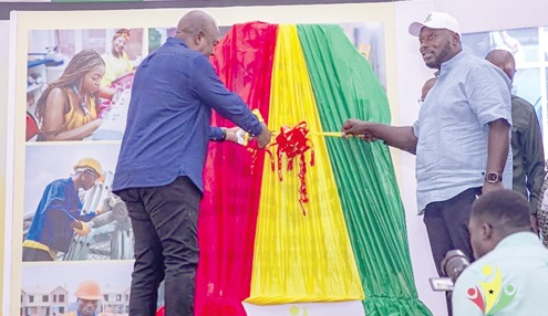 President Mahama being supported by George Opare-Addo (right), Minister of Youth Development and Empowerment, to cut the ribbon to officially launch the programme President Mahama being supported by George Opare-Addo (right), Minister of Youth Development and Empowerment, to cut the ribbon to officially launch the programme