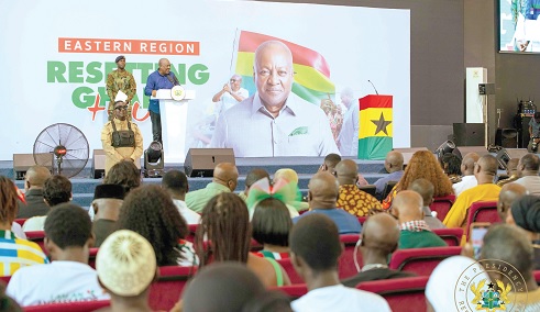 President John Dramani Mahama (arrowed), addressing  the gathering at a townhall meeting in Koforidua