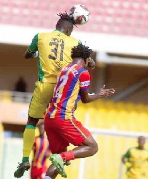 Kotoko's Kwame Opoku wins the aerial battle against Emmanuel Amankwah of Hearts during yesterday's game Kotoko's Kwame Opoku wins the aerial battle against Emmanuel Amankwah of Hearts during yesterday's game