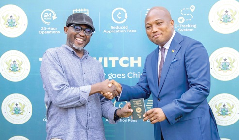 Samuel Okudzeto Ablakwa (right), Foreign Affairs Minister, presenting Francis Doku, the writer, with his chip-embedded passport Samuel Okudzeto Ablakwa (right), Foreign Affairs Minister, presenting Francis Doku, the writer, with his chip-embedded passport