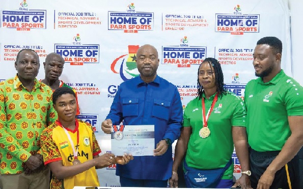 • Samson Deen (middle), President of the Ghana Paralympic Committee, welcomes medallists Zinabu Issah (2nd from right) and Gilbert Ampiah (3rd from left), along with members of the delegation, at the NPC Head Office in Accra • Samson Deen (middle), President of the Ghana Paralympic Committee, welcomes medallists Zinabu Issah (2nd from right) and Gilbert Ampiah (3rd from left), along with members of the delegation, at the NPC Head Office in Accra