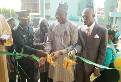 Mubarak-Mohammed Muntaka (2nd from right), Minister for the Interior, being assisted by Samuel Basintale Amadu (left), Comptroller-General, GIS; Kwame Asuah Takyi (right), former Comptroller-General, and Felix Yaw Sarpong (2nd from left), a former Comptroller-General, GIS, to inaugurate the facility Picture: CALEB VANDERPUYE Mubarak-Mohammed Muntaka (2nd from right), Minister for the Interior, being assisted by Samuel Basintale Amadu (left), Comptroller-General, GIS; Kwame Asuah Takyi (right), former Comptroller-General, and Felix Yaw Sarpong (2nd from left), a former Comptroller-General, GIS, to inaugurate the facility Picture: CALEB VANDERPUYE