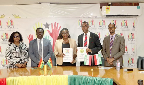 Kathleen Addy (middle), Chairperson, NCCE, and Khadar Nur Abdi (2nd from right), Director-General, Ministry of Parliamentary Relations and Constitutional Affairs, Somaliland, with the signed document after the ceremony. With them are Abdirisak Yusuf Jama (right), Director, Centre for Civic Education and Democracy; Lucille Hewlett Annan (left) an official of NCCE, and Victor Brobbey (2nd from left), NCCE Deputy Chairman in charge of General Services. Picture: ESTHER ADJORKOR ADJEI Kathleen Addy (middle), Chairperson, NCCE, and Khadar Nur Abdi (2nd from right), Director-General, Ministry of Parliamentary Relations and Constitutional Affairs, Somaliland, with the signed document after the ceremony. With them are Abdirisak Yusuf Jama (right), Director, Centre for Civic Education and Democracy; Lucille Hewlett Annan (left) an official of NCCE, and Victor Brobbey (2nd from left), NCCE Deputy Chairman in charge of General Services. Picture: ESTHER ADJORKOR ADJEI