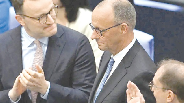 •Friedrich Merz (right) with a colleague MP in the German Bundestag •Friedrich Merz (right) with a colleague MP in the German Bundestag