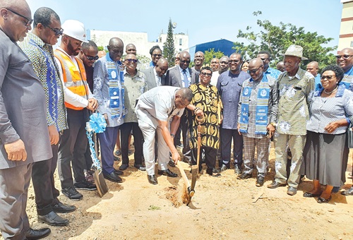 Kwame Governs Agbodza, Minister of Roads and Highways, cutting the sod for the commencement of the GhIS Centre of Excellence. With him are some staff of GhIS and other dignitaries. Picture: ERNEST KODZI Kwame Governs Agbodza, Minister of Roads and Highways, cutting the sod for the commencement of the GhIS Centre of Excellence. With him are some staff of GhIS and other dignitaries. Picture: ERNEST KODZI