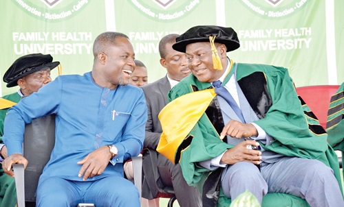 Kwabena Mintah Akandoh  (left), Health Minister, and Prof. Enyonam Yao Kwawukume, founder, Family Health Hospital, interacting at the programme