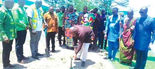 Jones Ofori Buadu, Deputy Executive Secretary of the Lands Commission, cutting the sod for work to begin on an office complex in Cape Coast