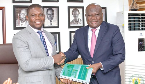 Kirk Koffi (right), Chairman of the Committee, presenting the report to Richard Gyan Mensah, Deputy Minister of Energy and Green Transition Kirk Koffi (right), Chairman of the Committee, presenting the report to Richard Gyan Mensah, Deputy Minister of Energy and Green Transition
