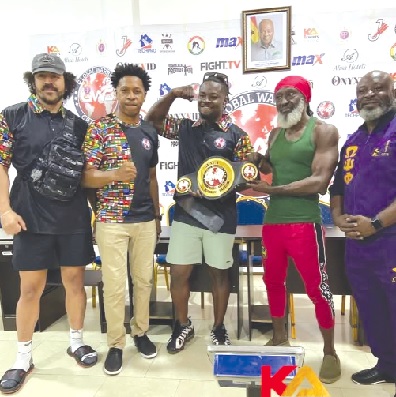 UFC star Abdul Razak Alhassan (centre) shares a moment with MMA Ghana President Jeff Taylor (second left), MMA advocate Reggie Rockstone, and other leading figures in Ghana's MMA community UFC star Abdul Razak Alhassan (centre) shares a moment with MMA Ghana President Jeff Taylor (second left), MMA advocate Reggie Rockstone, and other leading figures in Ghana's MMA community