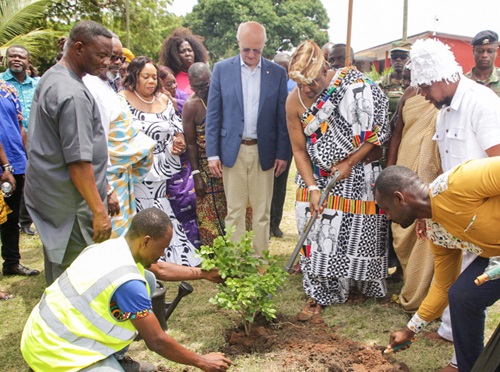 King Nii Tackie Teiko Tsuru II (3rd from right), Ga Mantse, covering the roots of a tree he planted with sand as Mário César Martins de Camargo (middle), President of Rotary International, and some officials look on Picture: CALEB VANDERPUYE King Nii Tackie Teiko Tsuru II (3rd from right), Ga Mantse, covering the roots of a tree he planted with sand as Mário César Martins de Camargo (middle), President of Rotary International, and some officials look on Picture: CALEB VANDERPUYE