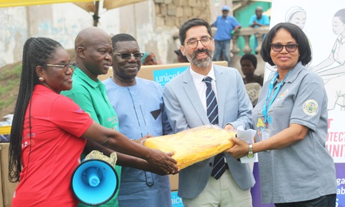 Dr Manuel Dewez (2nd from right), Chief of Health and Nutrition, UNICEF, and Charity Nikoi (right), SBC Specialist, UNICEF, presenting megaphones and aprons to Hafez Adams Taher (3rd from left), Ministry of Health representative; Prof. Samuel Kaba Akoriyea (2nd from left), Director-General, Ghana Health Service (GHS), and Mabel Asafo (left), acting Director, Health Promotion Division, GHS, during the launch Picture: ESTHER ADJORKOR ADJEI Dr Manuel Dewez (2nd from right), Chief of Health and Nutrition, UNICEF, and Charity Nikoi (right), SBC Specialist, UNICEF, presenting megaphones and aprons to Hafez Adams Taher (3rd from left), Ministry of Health representative; Prof. Samuel Kaba Akoriyea (2nd from left), Director-General, Ghana Health Service (GHS), and Mabel Asafo (left), acting Director, Health Promotion Division, GHS, during the launch Picture: ESTHER ADJORKOR ADJEI