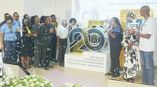 Prof. Nana Aba Appiah Amfo (3rd from right), Vice-Chancellor, UG, launching the 25th anniversary of the College of Health Sciences. Applauding are Prof. Alfred E. Yawson (4th from left), Provost of the college; Abena Osei Poku, MD, Ecobank Ghana, and Advisory board chair of the college, and other dignitaries.  Picture: ERNEST KODZI