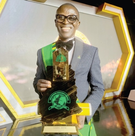 Dr Samuel Dotse, Founder and Chief Executive Officer of HATOF Foundation, displaying the award Dr Samuel Dotse, Founder and Chief Executive Officer of HATOF Foundation, displaying the award