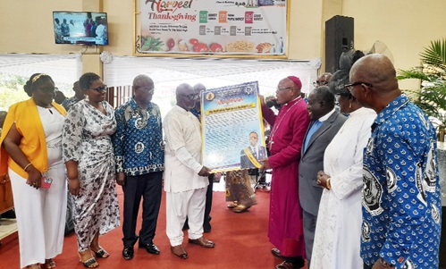 Rt Rev. Andrew Mbeah-Baiden (4th from right), Bishop of the Northern Accra Diocese of the Methodist Church Ghana, presenting a citation and gifts to Major Daniel Sowa Ablorh-Quarcoo (retd)