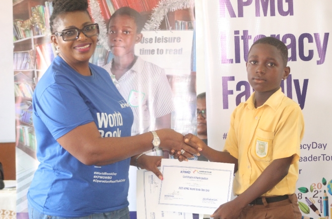 Patience Mawushie Dzikunoo Senior Manager, Accounting Advisory Services, presenting a certificate to Nkwaye Ofosu Obeng, after the Spelling Bee Competition. Picture: ESTHER ADJORKOR ADJEI 