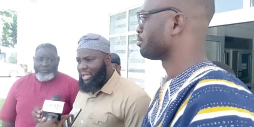 Nurideen Muhammed Mumuni (middle), NPP MP for Nalerigu/Gambaga, speaking to the media after presenting the petition to CHRAJ
